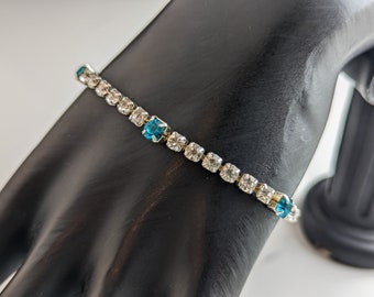Lovely Vintage Clear and Blue Rhinestone delicate bracelet by Avon Jewellery