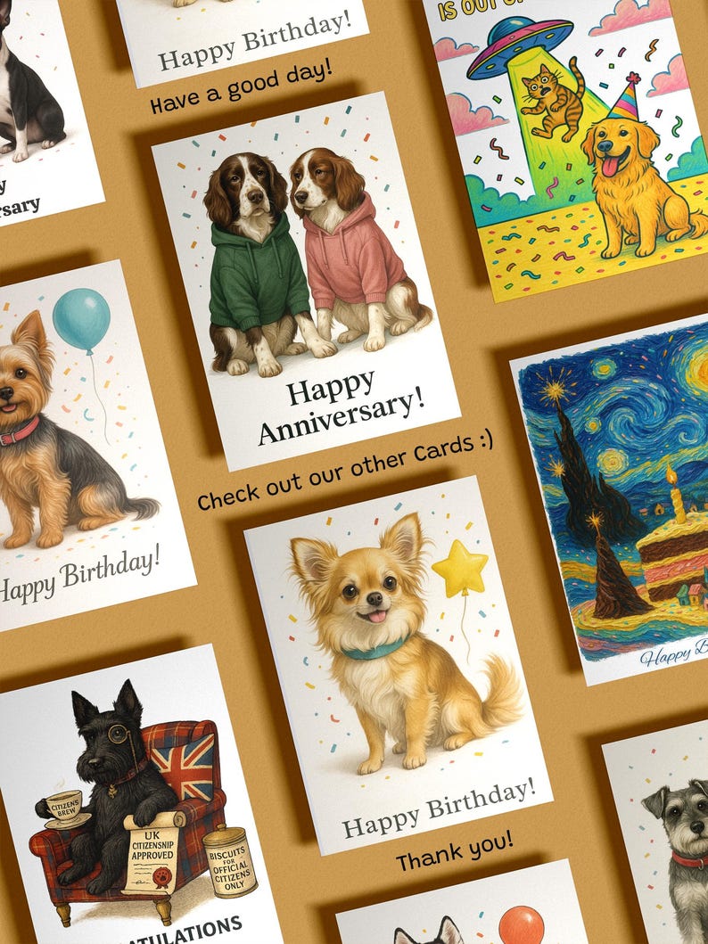 May include: A collection of greeting cards with various dog illustrations. One card reads "Happy Anniversary!" with two dogs wearing hoodies. Other cards say "Happy Birthday!" and "Thank you!"