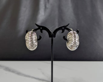 Lovely Silver-tone Hoop Clip On Earrings by Vendom Jewellery PAT 2809501