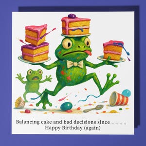 May include: A whimsical birthday card featuring a green frog balancing cake slices. The frog wears a bow tie and has its tongue out. The card includes the text "Balancing cake and bad decisions since ____ Happy Birthday (again)".