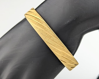 Classic and Elegant Gold-tone Bangle Bracelet by Monet Jewellery