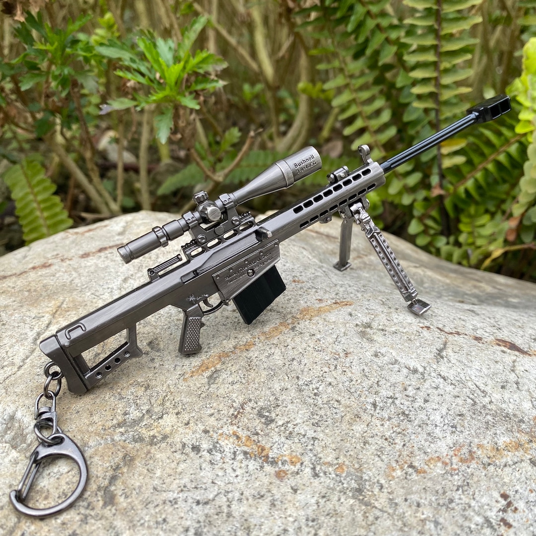 A Barrett .50-caliber M107 Sniper Rifle sits atop an observation point in  Afghanistan Solid-Faced Canvas Print