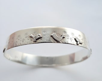 Wee bird and meadow handmade recycled silver bangle