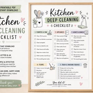 May include: A framed "Kitchen Deep Cleaning Checklist" printable PDF with a minimalist design. The checklist includes sections for counters, appliances, cabinets, floors, and trash. The image also includes a vase with wooden utensils.