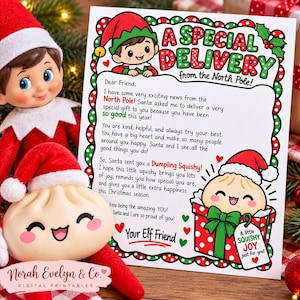 May include: A printed letter titled A Special Delivery from the North Pole featuring a cartoon elf and a dumpling character. The text describes a gift from Santa. A plush elf doll holds a round, smiling dumpling toy with a red Santa hat.