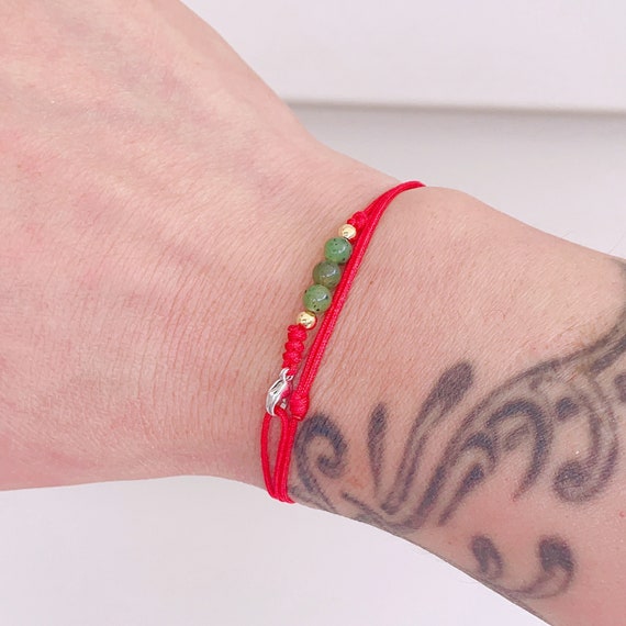 Jade bracelet with red string outlet