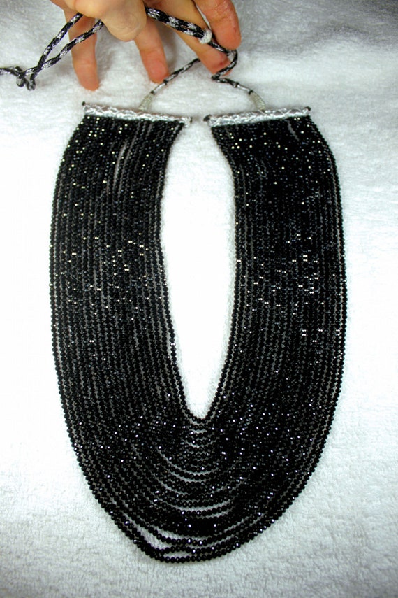 917.0 Tcw. Faceted 20 Strand Black Spinel Necklace
