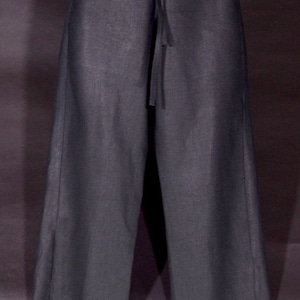May include: A pair of black wide-leg pants with a drawstring waist.