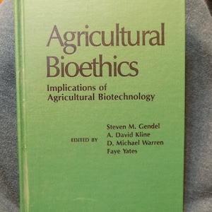 May include: A green book titled "Agricultural Bioethics: Implications of Agricultural Biotechnology" with the names of the editors: Steven M. Gendel, A. David Kline, D. Michael Warren, and Faye Yates.