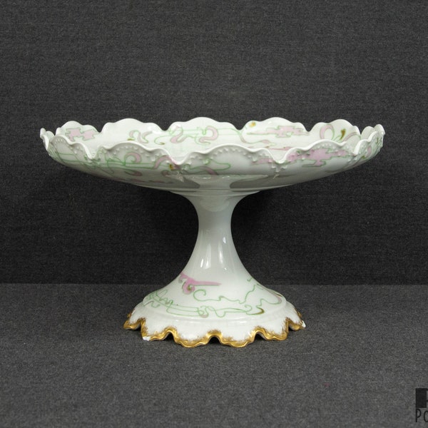 An Antique Haviland Limoges Cake Stand (chips on the bottom rim)