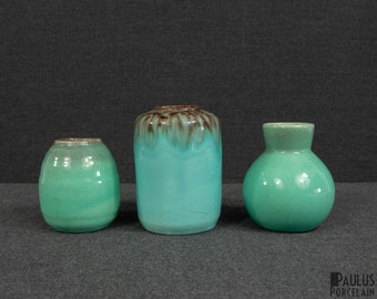 A set of Three Small Ceramic Vases