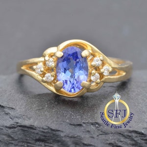 Gerestaureerde vintage ring met tanzaniet en diamant, 14 kt geelgoud, bypass-wervelring