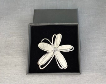 Stylish and elegant Boxed Silver Flower brooch.