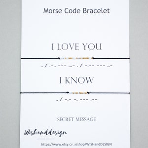 May include: A white card with black text that reads "Morse Code Bracelet". The card shows two black strings with white and gold beads that spell out "I LOVE YOU" and "I KNOW" in Morse code. The card also includes the text "SECRET MESSAGE" and the shop name "Wishanddesign".