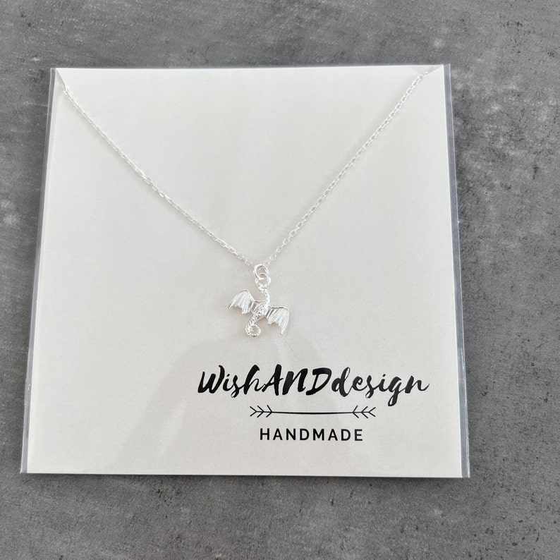 handcrafted sterling silver necklace with small flying dragon pendant on adjustable chain