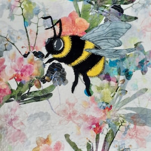 May include: A close-up of a black and yellow bumblebee with a gray wing, perched on a pink flower. The bee is surrounded by a watercolor-like background of pink, blue, and green flowers.