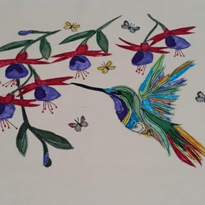 May include: A colorful watercolor painting of a hummingbird and fuchsia flowers. The hummingbird is depicted with green, blue, and yellow feathers, and a long black beak. The fuchsia flowers are red and purple, with green leaves. Several butterflies are also present.