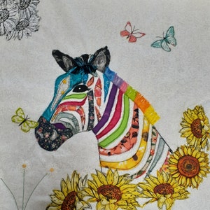 May include: A colorful patchwork zebra made of fabric scraps, with a rainbow mane and a black and white striped body. The zebra is surrounded by yellow sunflowers with brown centers.
