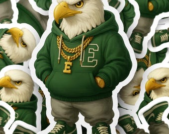 May include: A sticker featuring an anthropomorphic eagle wearing a green hoodie with the letter "E", gold chain, and green sneakers. The eagle has a white head, yellow beak, and is wearing gray pants. The sticker has a white border.
