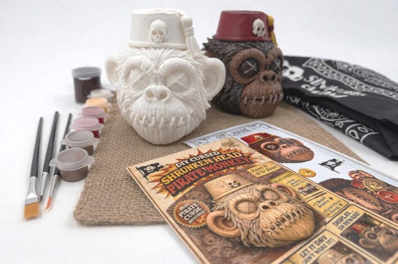 Paint-your-own cursed shrunken monkey skull kit — a gothic craft activity and desk oddity rolled into one darkly delightful package.