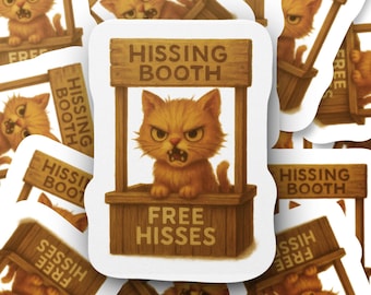 May include: A sticker depicting an orange cat with an angry expression inside a wooden booth. The booth has a sign that reads "HISSING BOOTH" and "FREE HISSES". The cat is the central focus of the sticker.