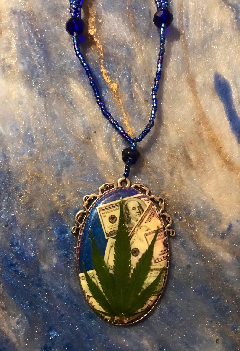 Money necklace with real marijuana leaf on 3 strand blue iridescent bead necklace with crystal accent beads