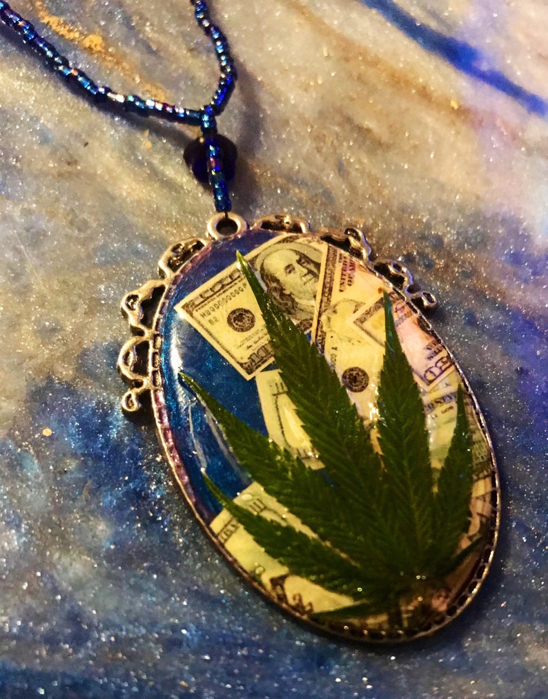 Money necklace with real marijuana leaf on 3 strand blue iridescent bead necklace with crystal accent beads