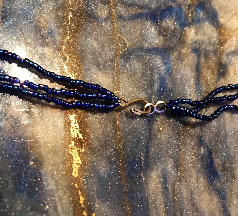Money necklace with real marijuana leaf on 3 strand blue iridescent bead necklace with crystal accent beads