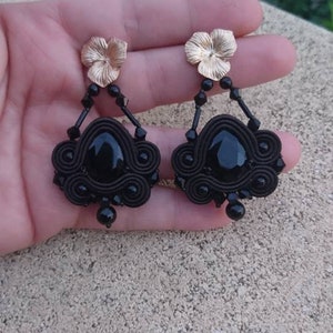 Black soutache earrings with gold-colored flower pin