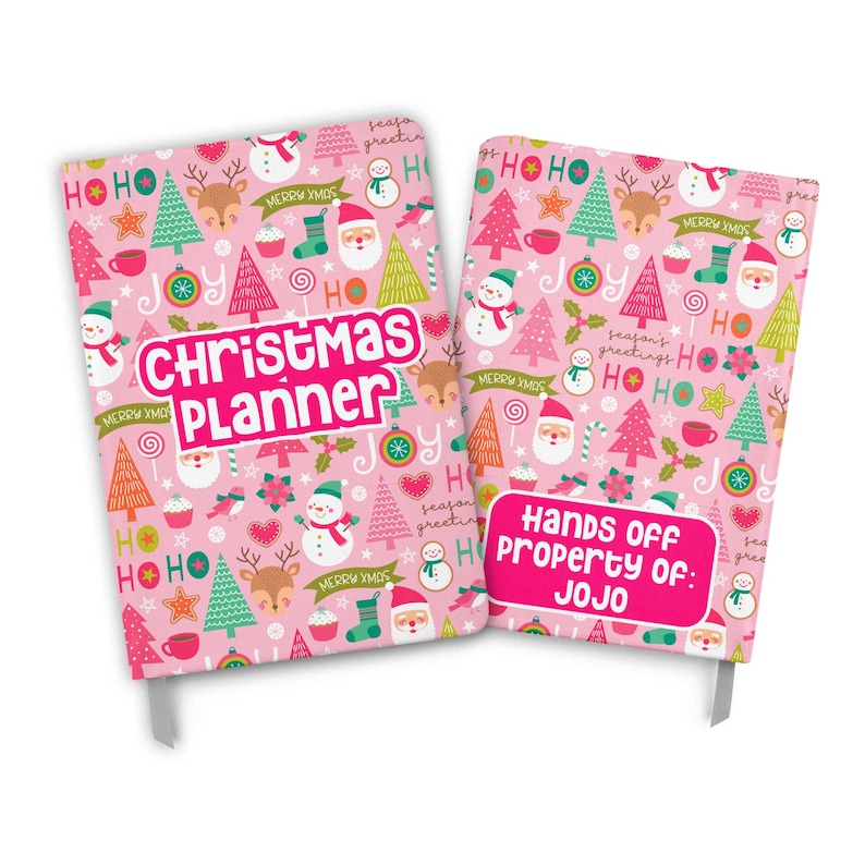 May include: Pink Christmas planner notebook with a festive pattern of Christmas trees, reindeer, snowmen, candy canes, and the words "HO HO HO" and "Merry Xmas". The back cover has a pink label with the text "Hands Off Property of: JOJO".