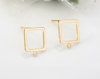 May include: A pair of gold-tone square earring blanks with a small jump ring on the bottom of each square.