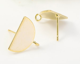May include: Two gold-toned earring blanks with a half-circle shape. The earring blanks have a small loop on the side and a post on the back.