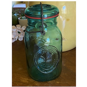 Frasco de vidrio de un cuarto de galón Ball Ideal con emblema de águila para celebración del bicentenario de 1776 y 1976, tapa de alambre azul agua