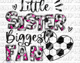 May include: A graphic design featuring the text "Little Sister Biggest Fan." The words "Sister" and "Fan" are filled with soccer ball patterns and pink accents. A soccer ball heart is also included.