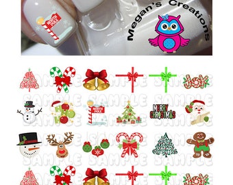 May include: A sheet of 20 Christmas nail decals featuring various festive designs, including a snowman, reindeer, candy canes, a Christmas tree, bells, a gift box, and a gingerbread man. The decals are printed on a white background.
