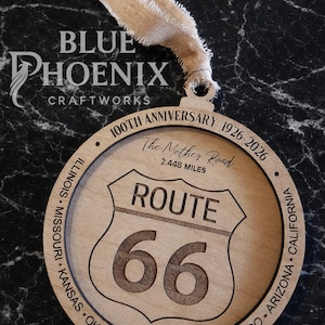 May include: Wooden Route 66 ornament with engraved details. Features the Route 66 shield, the text "ROUTE 66", and "100th Anniversary 1926-2026". Includes a beige ribbon for hanging. The text "DIGITAL FILE" and "SVG & PDF FILES" are also visible.