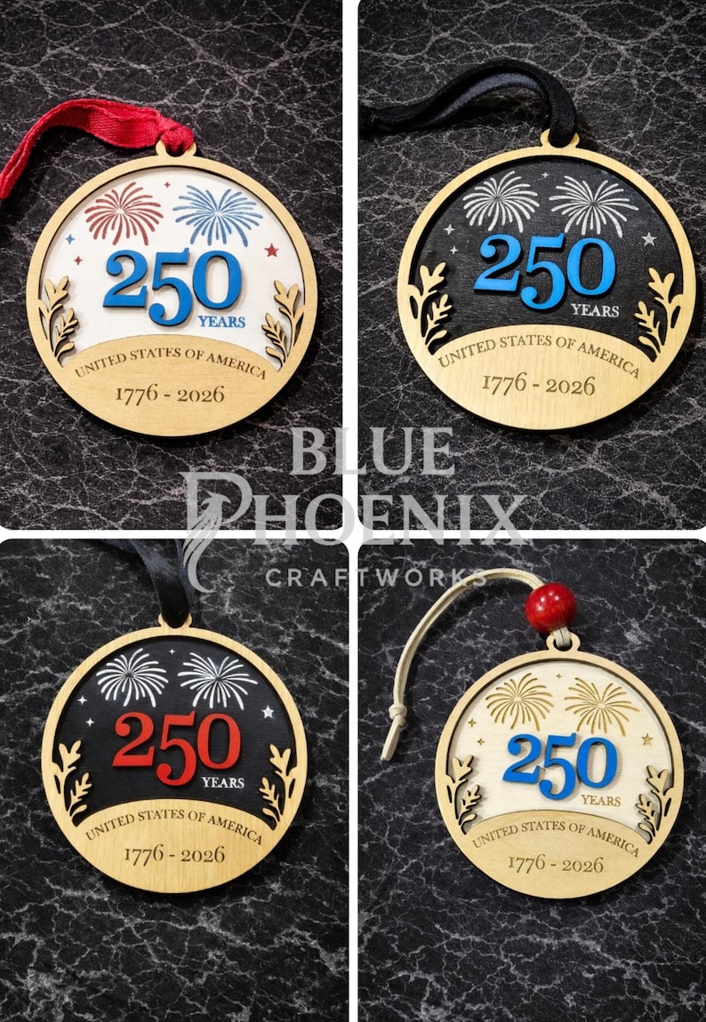 May include: Wooden ornaments with a circular design, featuring the text "250 YEARS UNITED STATES OF AMERICA 1776-2026". The ornaments have a fireworks design and are available in various color schemes, with red, white, and blue accents.