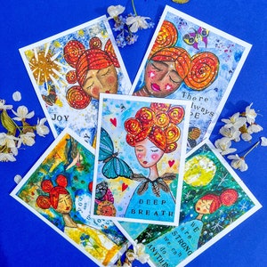 L’ensemble bleu de cartes postales positives - cartes à envoyer - affirmer - élever - optimiste - art joyeux