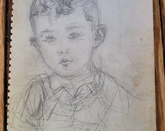 May include: A pencil sketch of a young boy's face with a handwritten inscription that reads "à la plus adorable grand mère S. Carvallo".