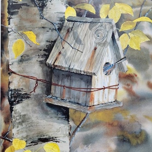 May include: A wooden birdhouse with a grey roof and a brown base is attached to a birch tree. The birdhouse has a small opening on the front and a bird is perched on the edge of the opening. The tree is surrounded by yellow leaves.