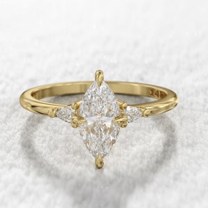 Marquise Engagement Ring. 1ct Moissanite Marquise & 0.10 Moissanite pear side stones , solid gold ring