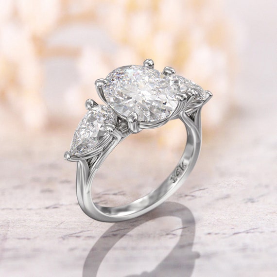 Oval cut 3 shop stone engagement rings