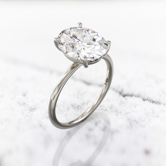 Dainty oval engagement best sale rings