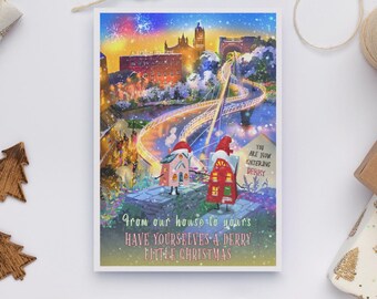 May include: A Christmas card featuring a colorful illustration of a city scene with a bridge and buildings. Two cartoon houses wearing Santa hats are in the foreground. The card includes the text "From our house to yours, Have yourselves a Derry little Christmas."