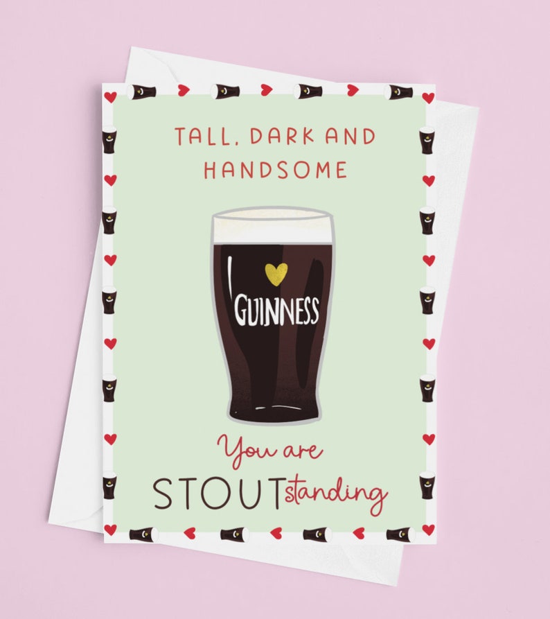 May include: A green card with a white border and a red heart pattern. The card features a cartoon illustration of a glass of Guinness beer with a heart on the label. The text on the card reads "Tall, dark and handsome. You are Stoutstanding."