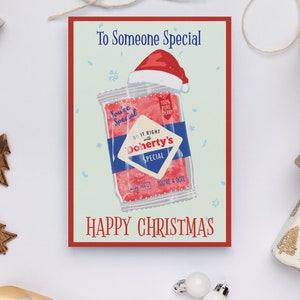 Puede incluir: Una tarjeta de Navidad con una ilustración roja y blanca de un paquete de dulces con el texto "You're Special" y "Doherty's Special". La tarjeta tiene un borde rojo y el texto "To Someone Special" y "Happy Christmas".