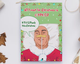 May include: A Christmas card with a cartoon illustration of a man in a hospital bed wearing a Santa Claus outfit. The card reads "All I want for Christmas is €394.127" and "H'll U.S.B lovely this Christmas."
