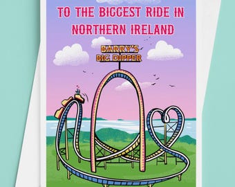 May include: A greeting card featuring a colorful illustration of a roller coaster with the text "TO THE BIGGEST RIDE IN NORTHERN IRELAND" and "BARRY'S BIG DIPPER". The card has a white envelope.