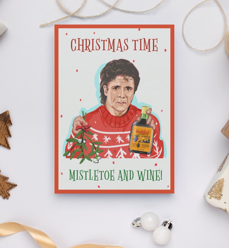 May include: A Christmas card featuring a man in a red sweater holding a bottle of wine and a sprig of mistletoe. The card reads "Christmas Time Mistletoe and Wine!"