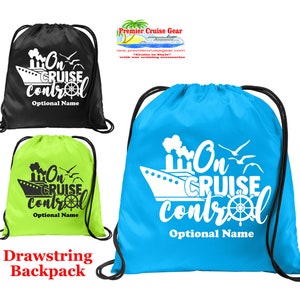 May include: Three drawstring backpacks with the text "On Cruise Control" and a cruise ship graphic. The backpacks are black, green, and blue.